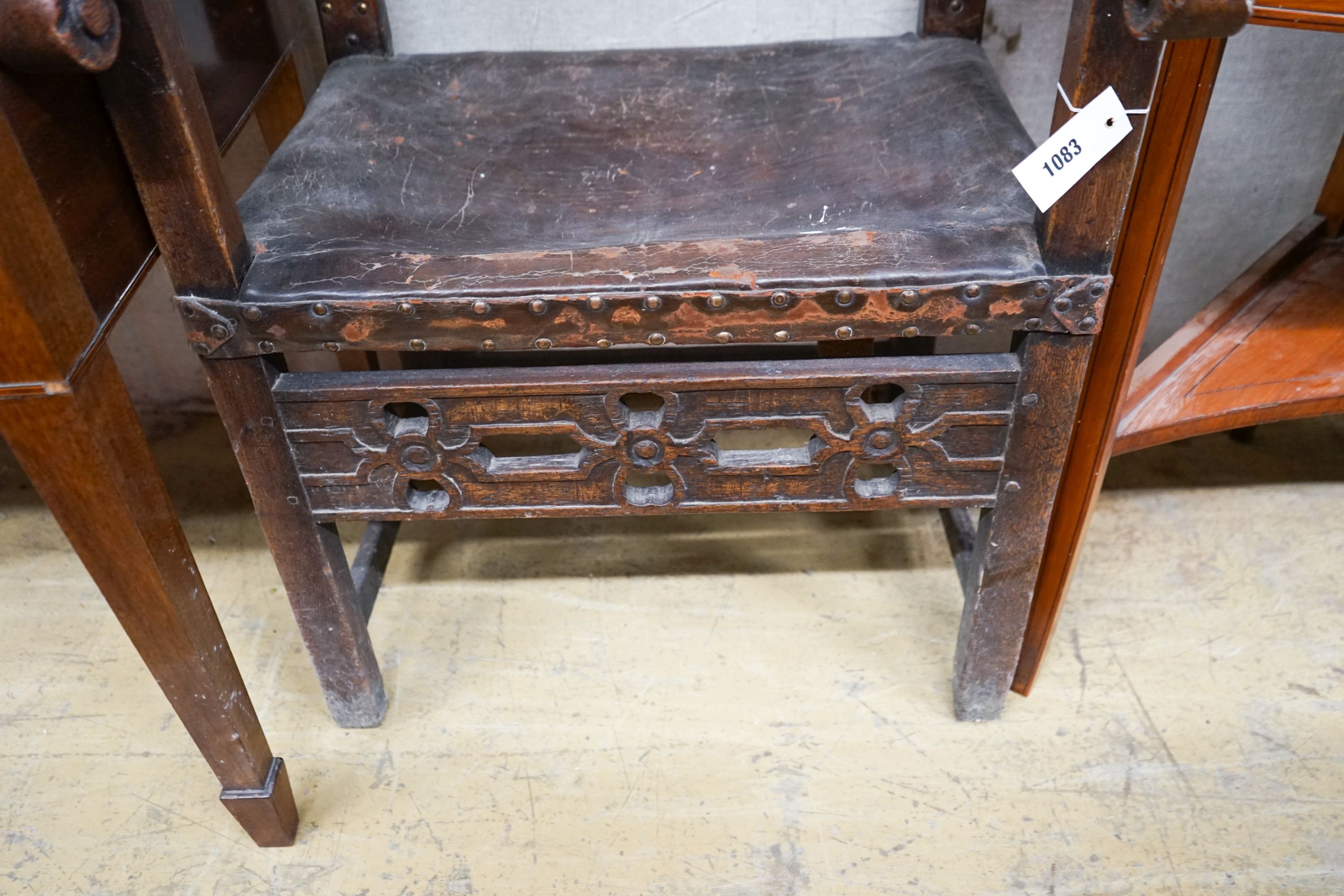 An 18th century oak elbow chair, width 59cm, depth 54cm, height 96cm